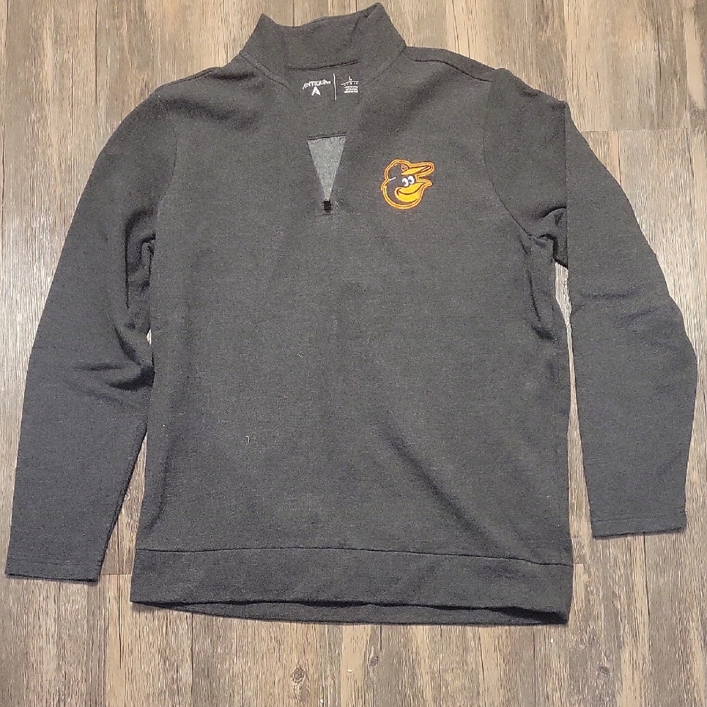 Baltimore Orioles Antigua "Victory" Quarter-Zip Pullover.